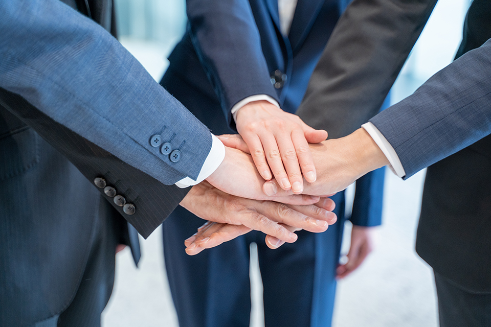 Hands together representing teamwork and partnership